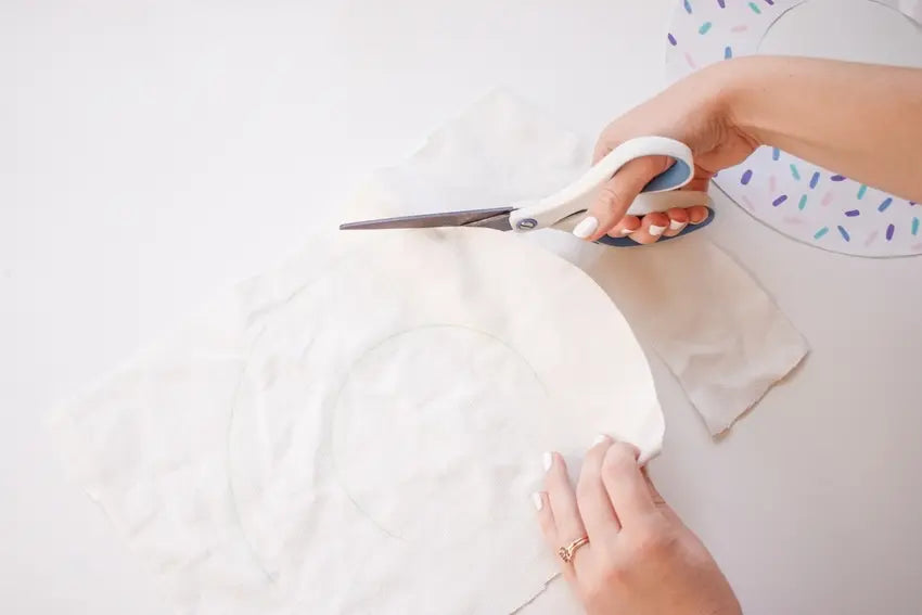 Cut out donut shape from fabric.