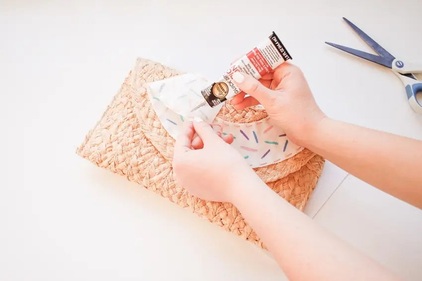 Glue donut fabric onto clutch