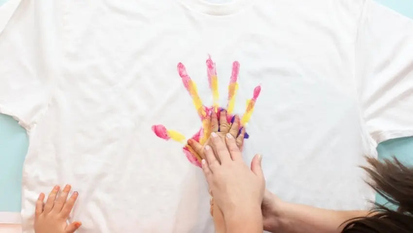 Paint child's hand and press onto shirt