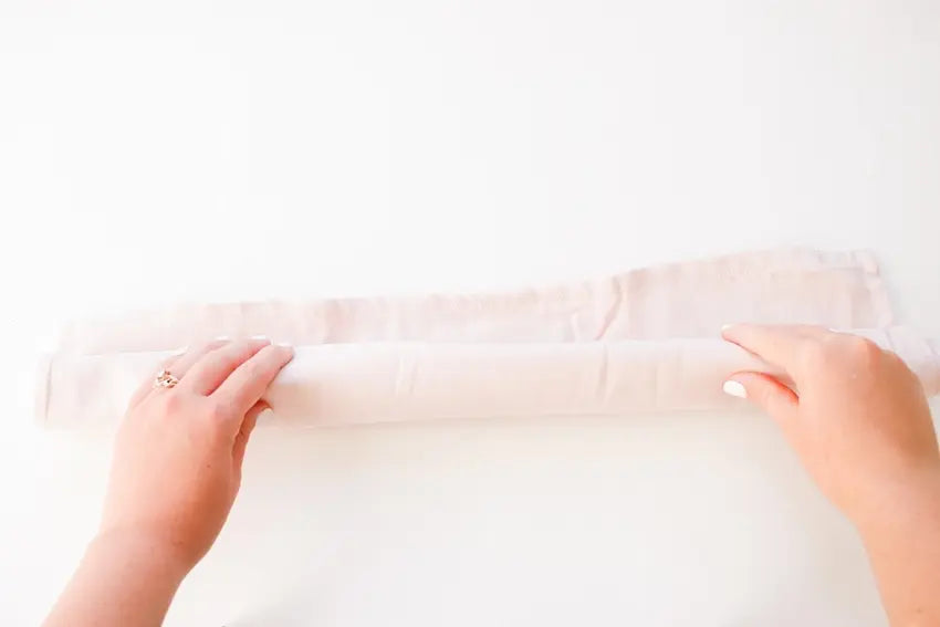 Roll pillow cover into a tube