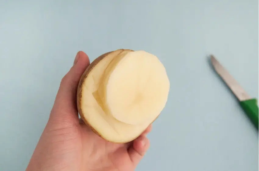 Carve circle from potato surface