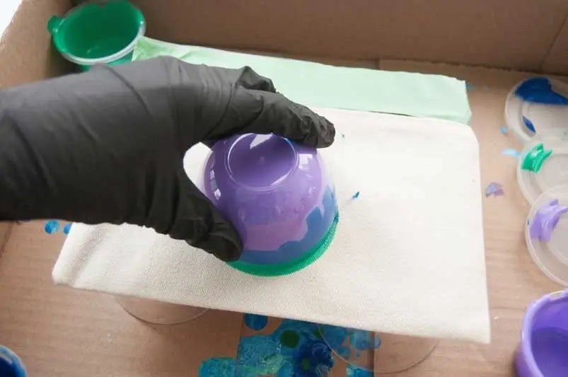 Place pouch on paint cup and flip over