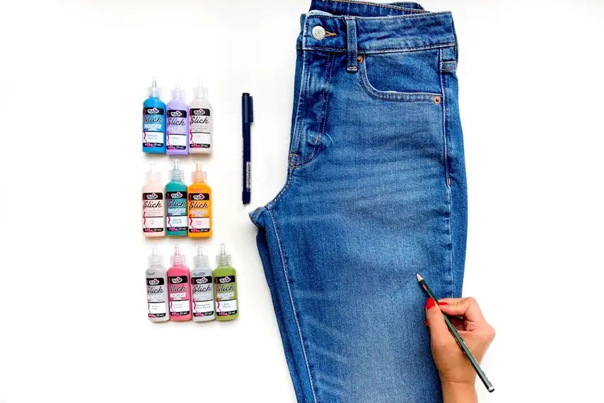 Sketch designs on jeans with a pencil