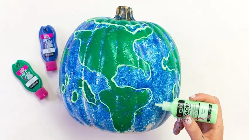 Outline continents with Green Glow Paint