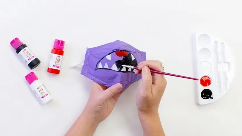 Use fabric paints to decorate your monster mask