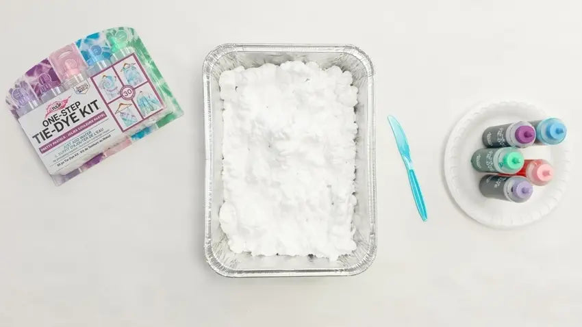 Fill tray with shaving cream and prepare dyes