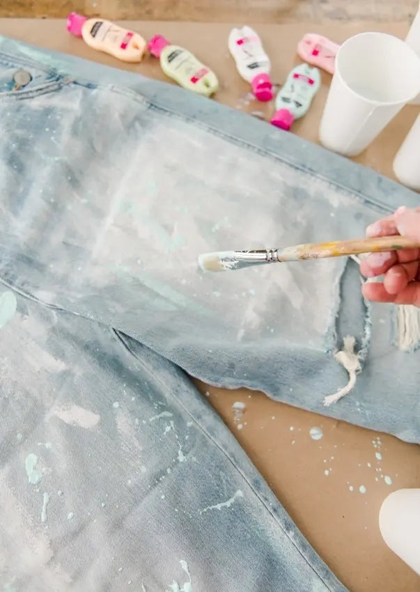 Splatter paint onto overalls