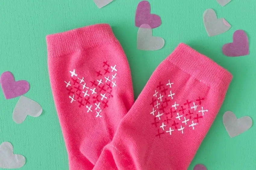 14. DIY Cross Stitch Heart Socks with Puff Paint
