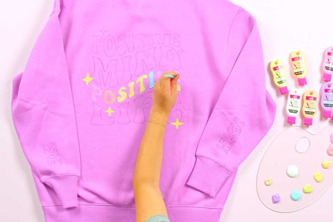 : Paint the custom sweater with soft fabric paint