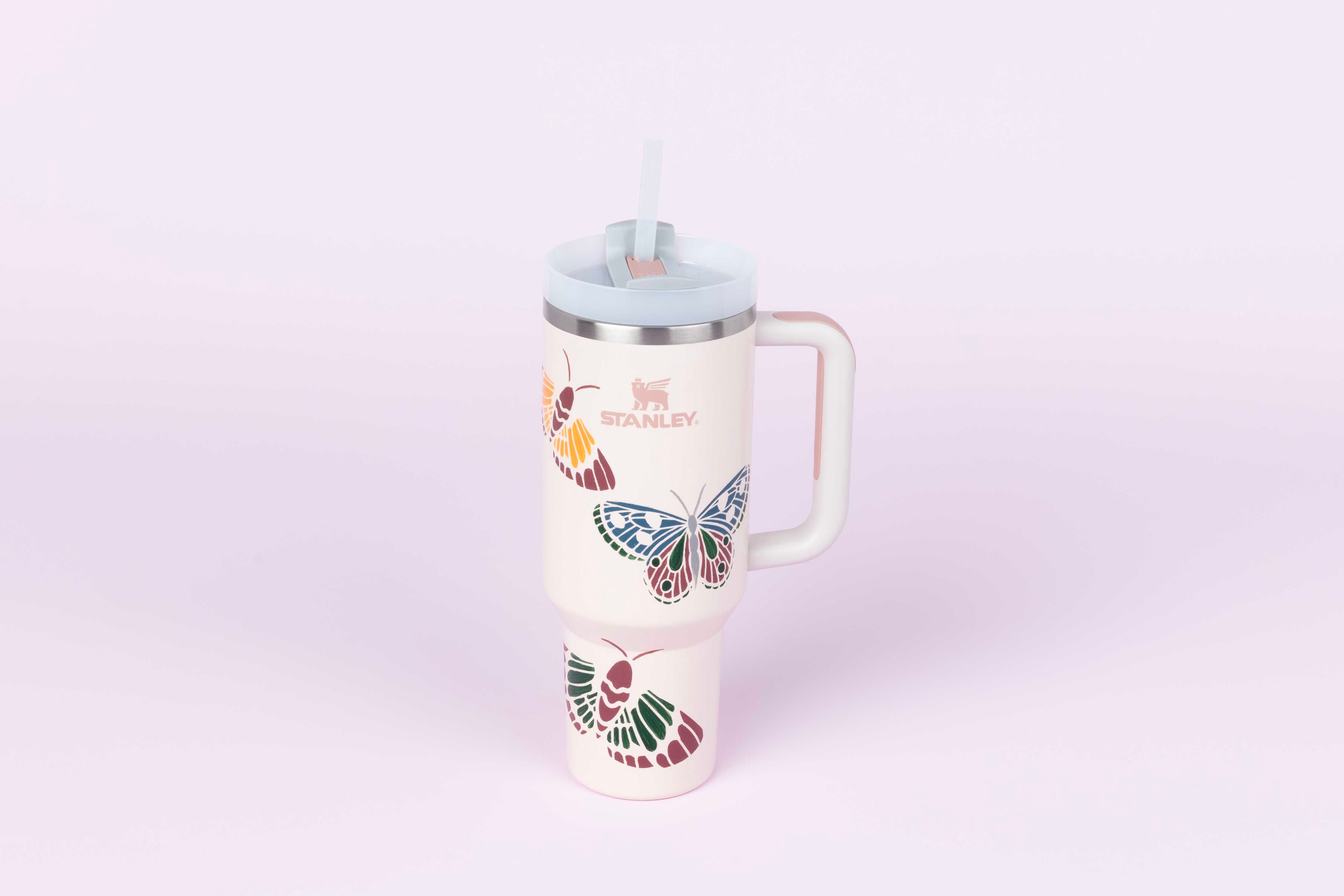 Custom tumbler cup with painted butterflies