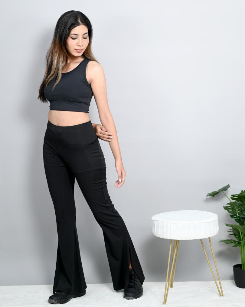 Navy sports flare pants with slit for women, ankle length gym pants.