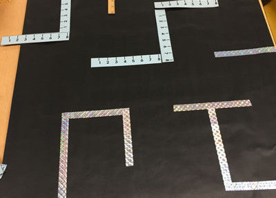 Applying tape to Pacman door maze