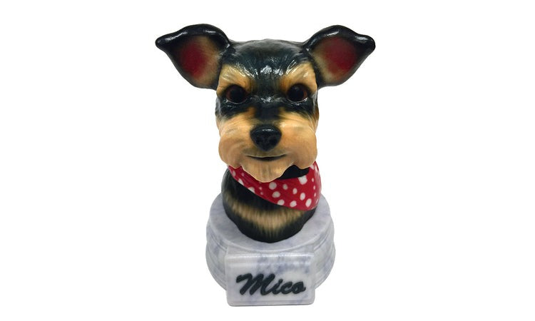A custom ceramic pet urn of a dog named Mico