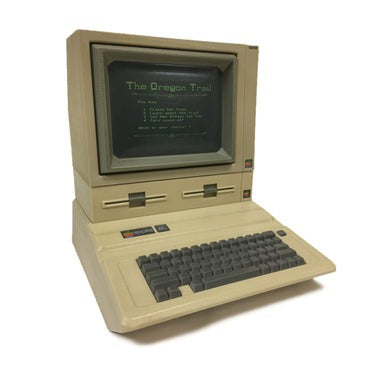 old-school computer urn with Oregon Trail on screen