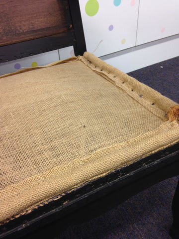 Edge roll on the base of a seat during reupholstery