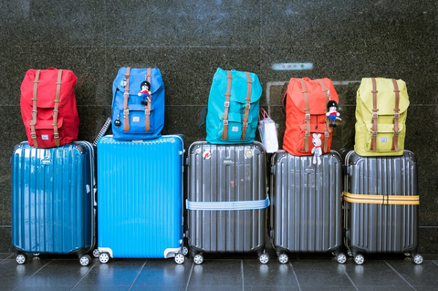 colourful suitcases and backpacks
