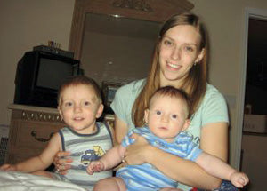 Denise holding her young sons, 2007