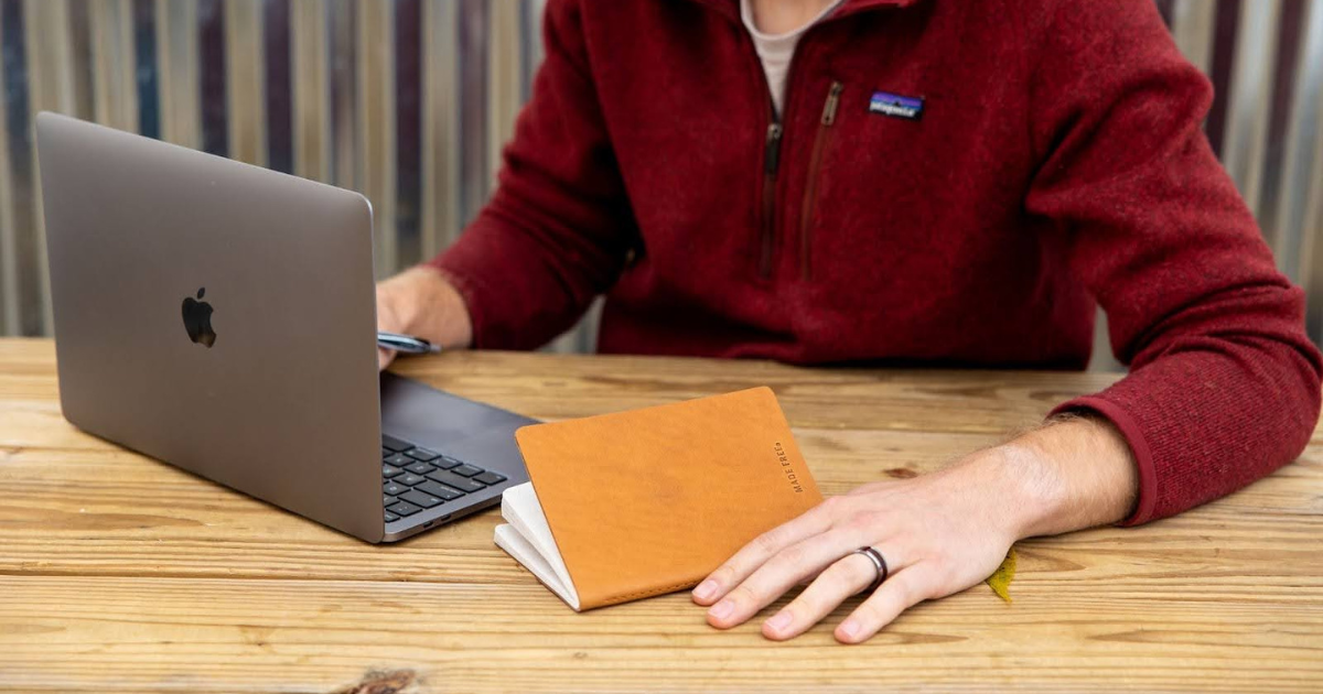 Corporate man working with eco friendly journal