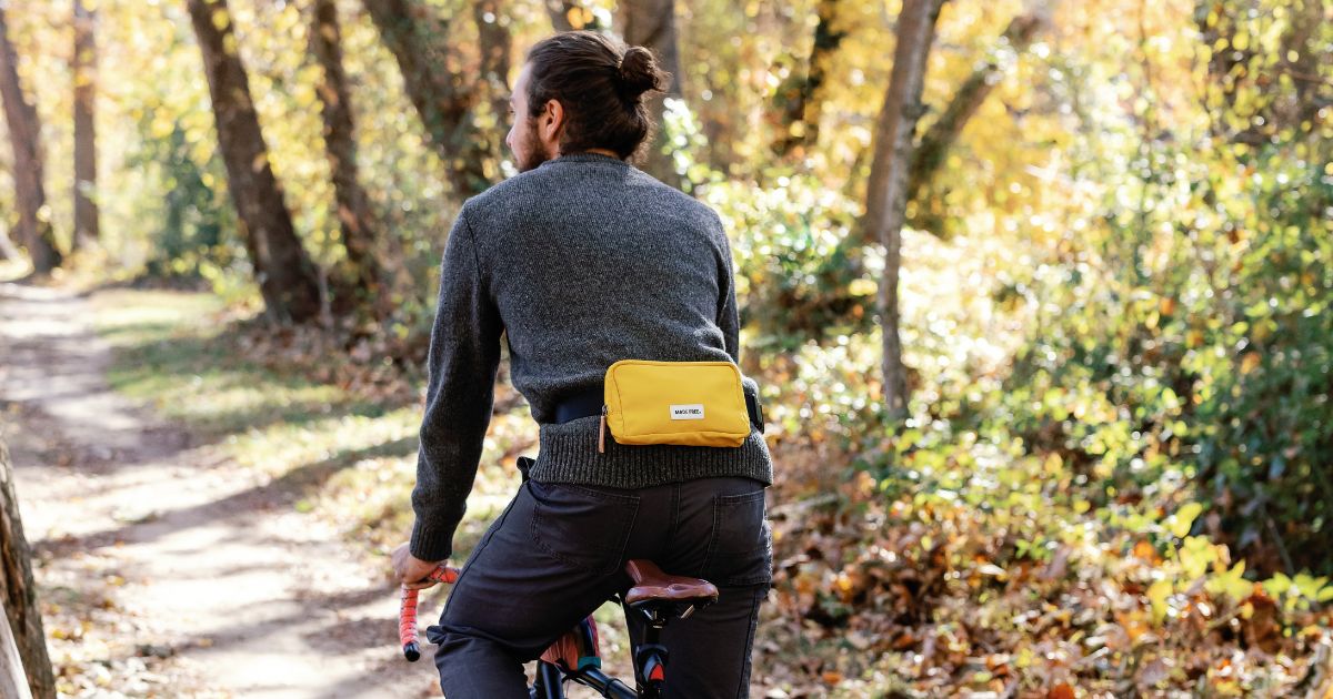 man riding bike wearing reverse fanny pack style