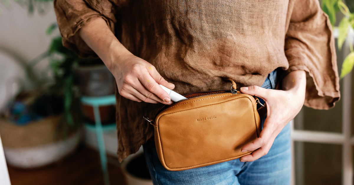 woman carrying leather belt bag for essentials