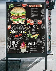 An 'A' board outside a cafe with a menu printed onto a magnetic board attached to it