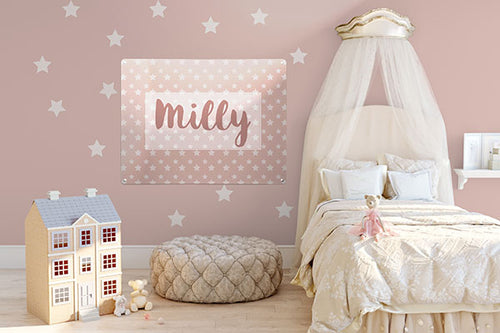 A child's bedroom styled in pink with a bed, doll's house and pink magnetic board personalised with the name Milly