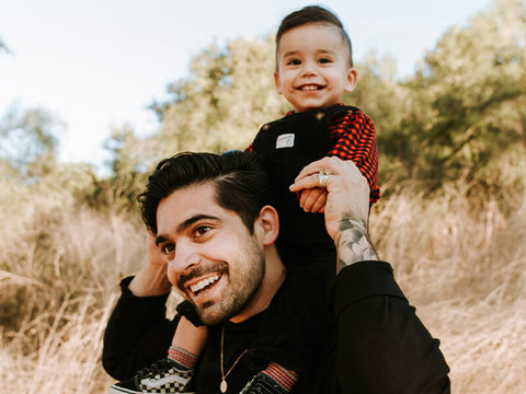 dad with baby boy over his shoulders