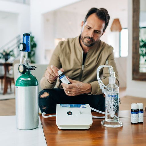 Man using home ozone generator from Simply O3.