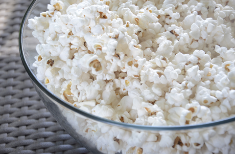 Popcorn in a glass bowl.