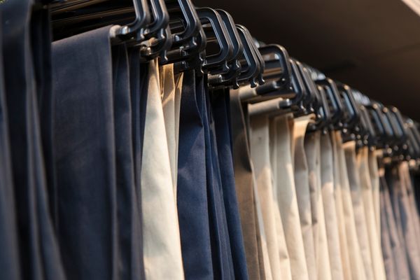 Work pants hanging to retain shape