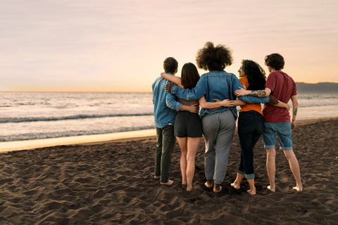 Small Group of Travelers Enjoying the Beachside