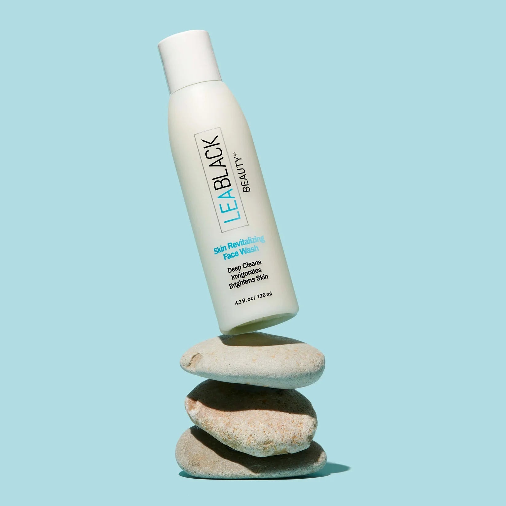 Lea Black Beauty® Daily Face Wash on top of rocks