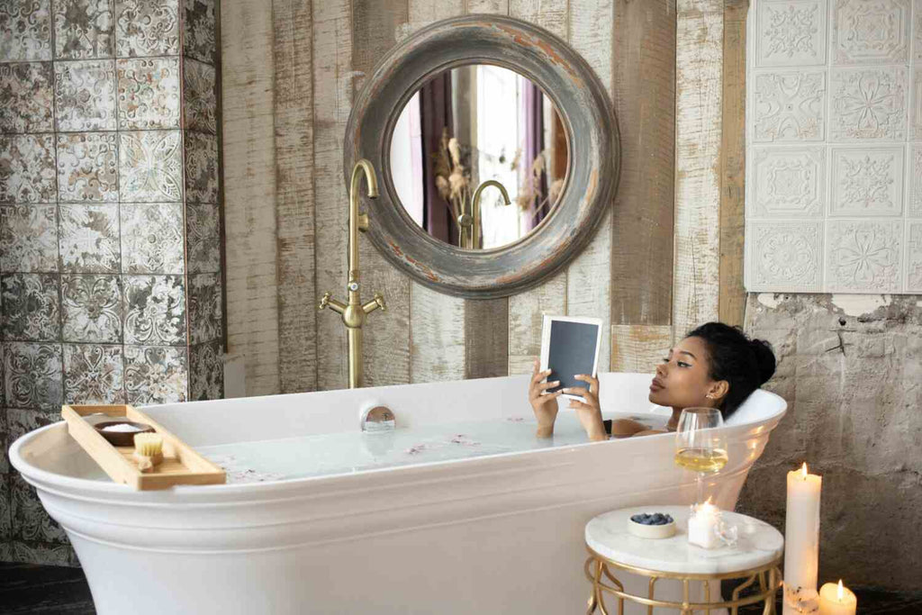 A woman reading a book in a bathtub