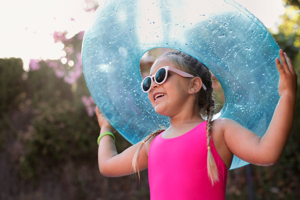 Child having fun with an inflatable water toy