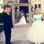 Kids holding wedding frame