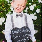 Ring bearer holding sign