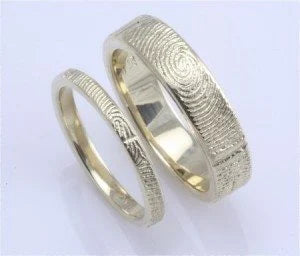 http://apracticalwedding.com/2011/09/brent-jess-handcrafted-fingerprint-wedding-rings/
