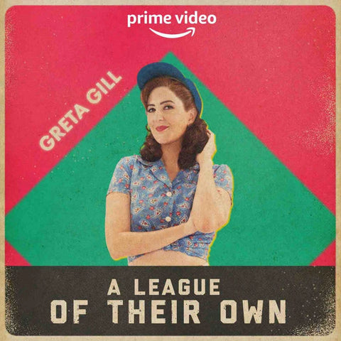 Promotional poster for the TV show "A League of Their Own" featuring the character Greta Gill, set against a backdrop of red and green triangles with the Prime Video logo.