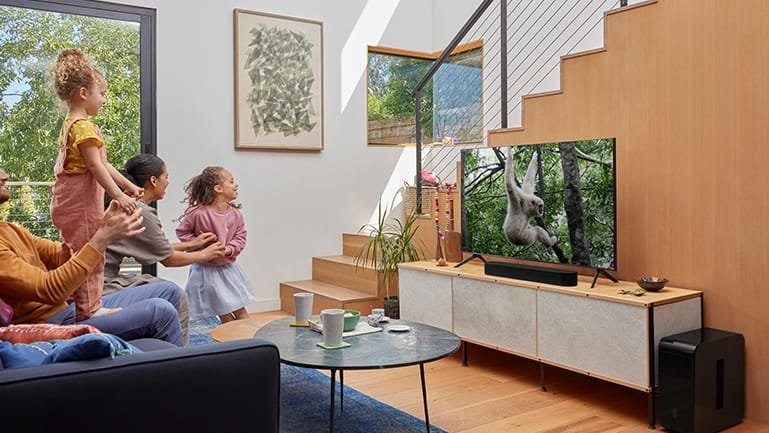 Family watching TV with Sonos Beam Gen 2