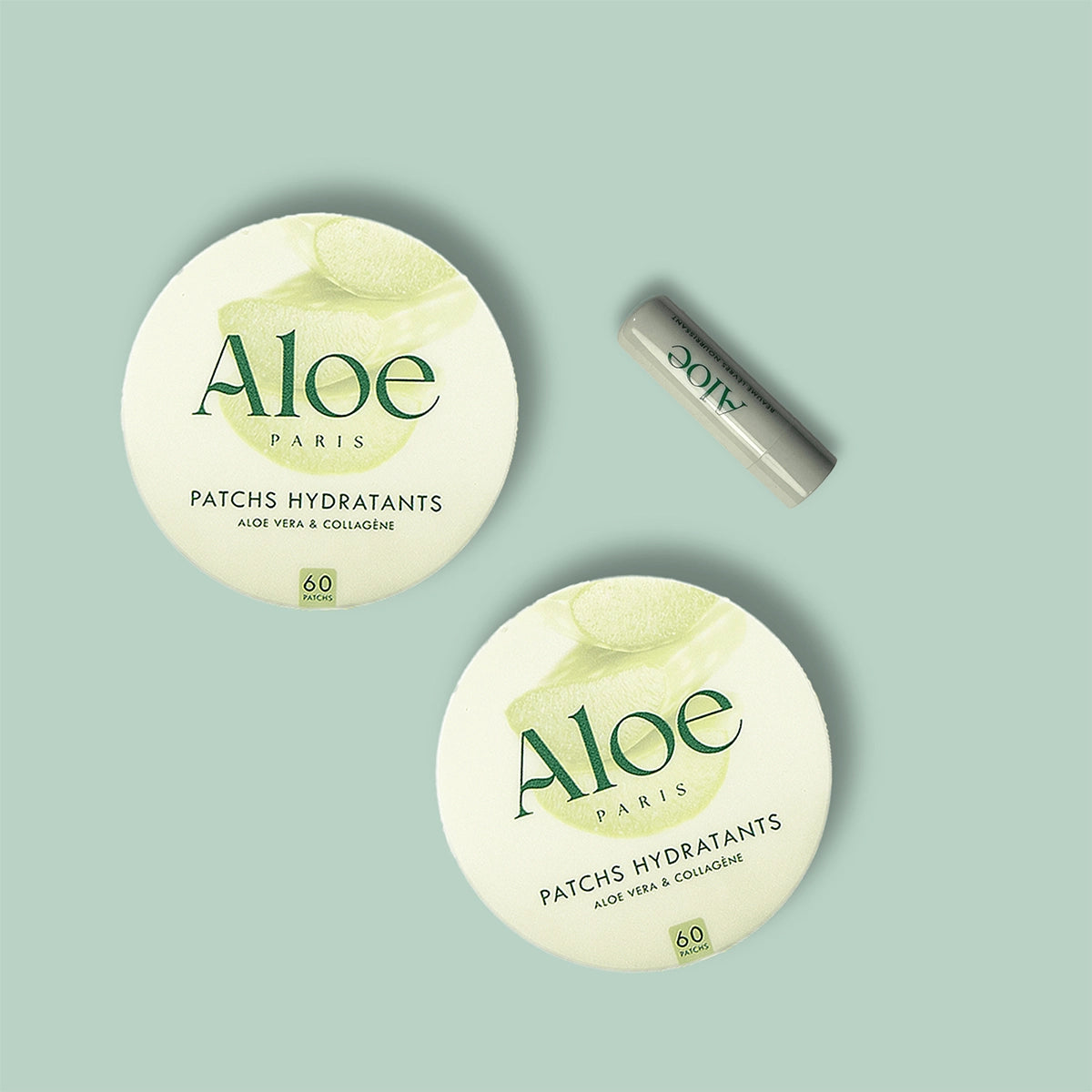 Two containers of Aloe Paris hydrating patches with aloe and collagen on a pale background.