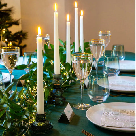 Green glass candlesticks On a green tablecloth