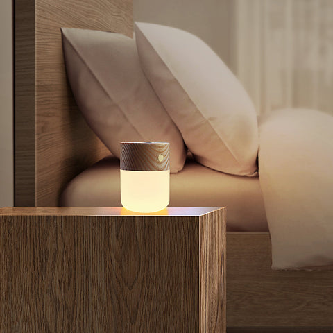 Diffuser Lamp on wooden bedside with white pillows