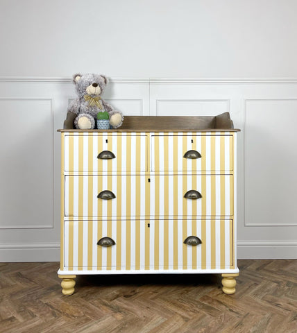 White and Yellow Striped Painted Chest of Drawers on wooden floor with white wall