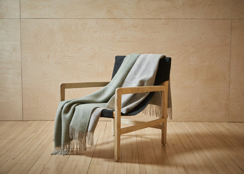 Dartmoor green wool throw over a chair