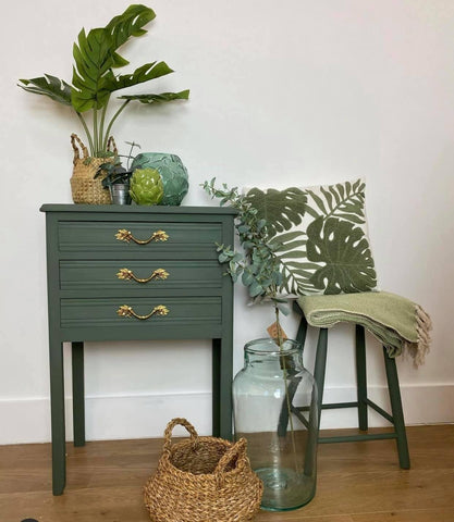 Green painted Chest of drawers and stool with green home accessories