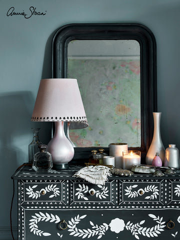 Painted Black Mirror on a dressing table with lamp