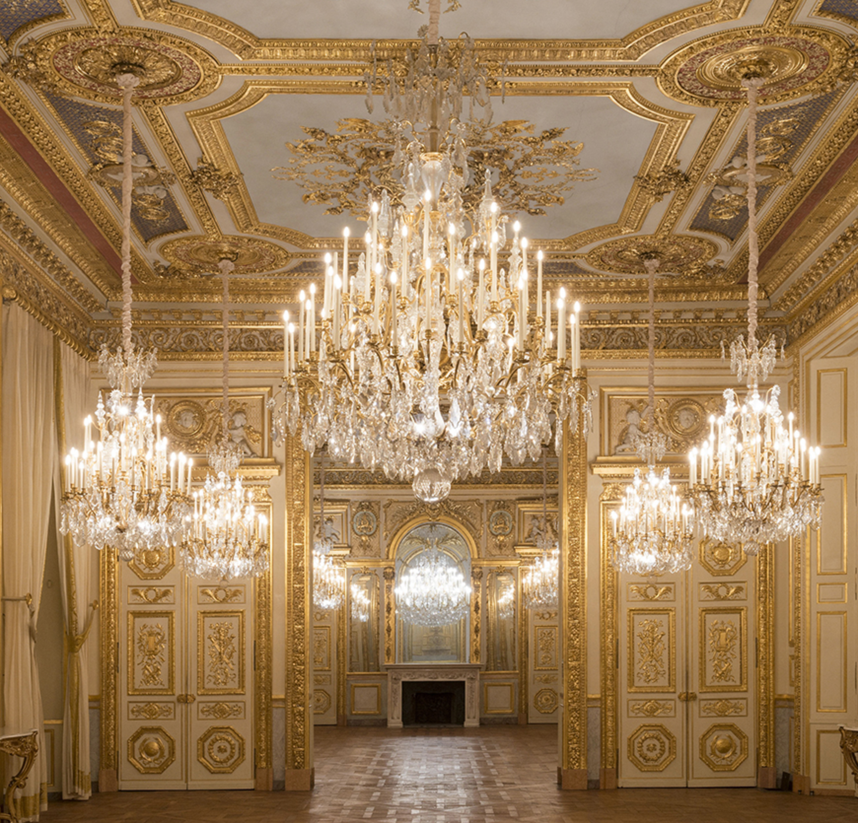 View of the gold and chandelier rooms in the Hotel de la Marine Paris.