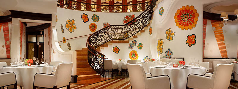 colorful Wynn Resort restaurant interior with staircase