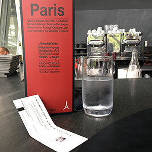 paris map with red cover at the bar in the fondation louis vuitton