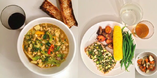 photo of hearty meals with soup, fish, corn on cob and wine